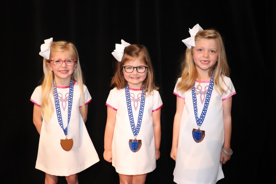 3 little girls with medals on