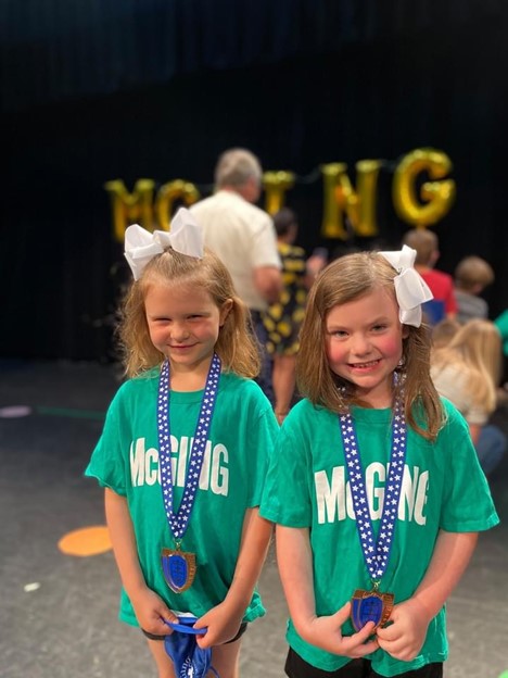 Two little girls at a dance event